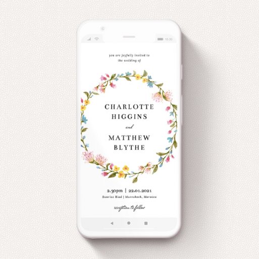 A digital wedding invite named "Spring Wreath". It is a smartphone screen sized invite in a portrait orientation. "Spring Wreath" is available as a flat invite, with mainly pink colouring.