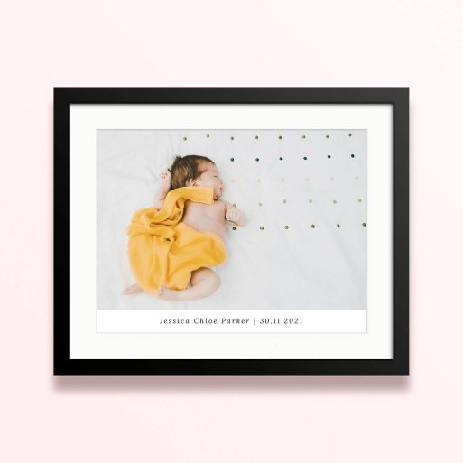 Framed and mounted photo print featuring a single baby photo