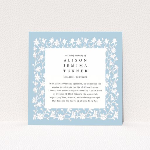 Floral border funeral announcement with blue background and text in the centre