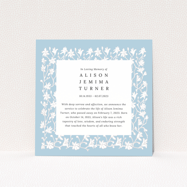 Floral border funeral announcement with blue background and text in the centre