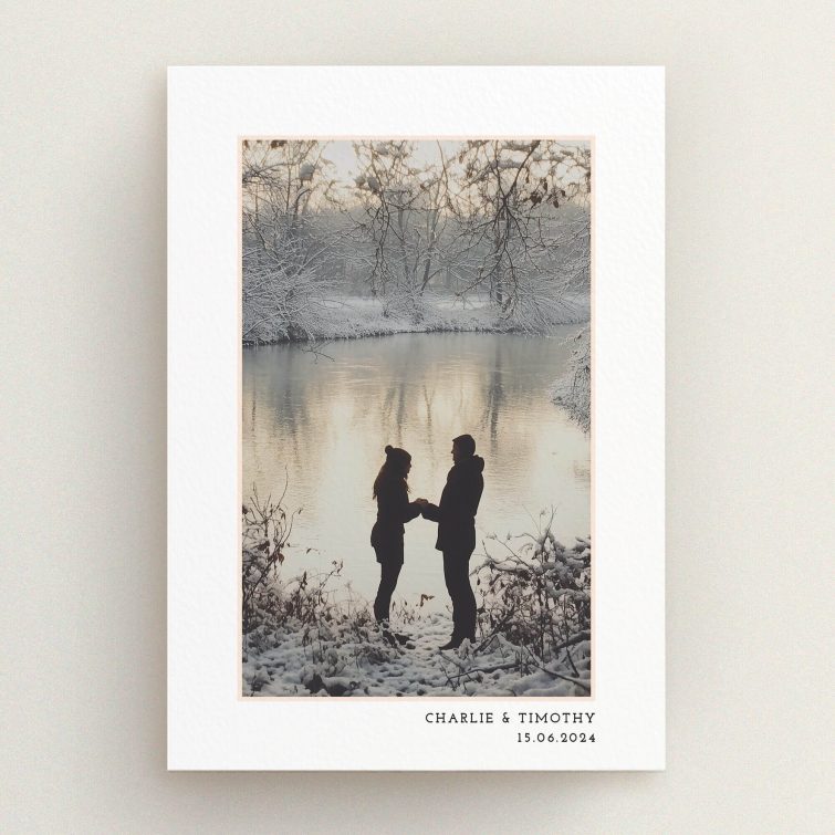 Elegant engagement party invitations featuring a romantic winter scene with a silhouetted couple by a lake, perfect for personalised event announcements.