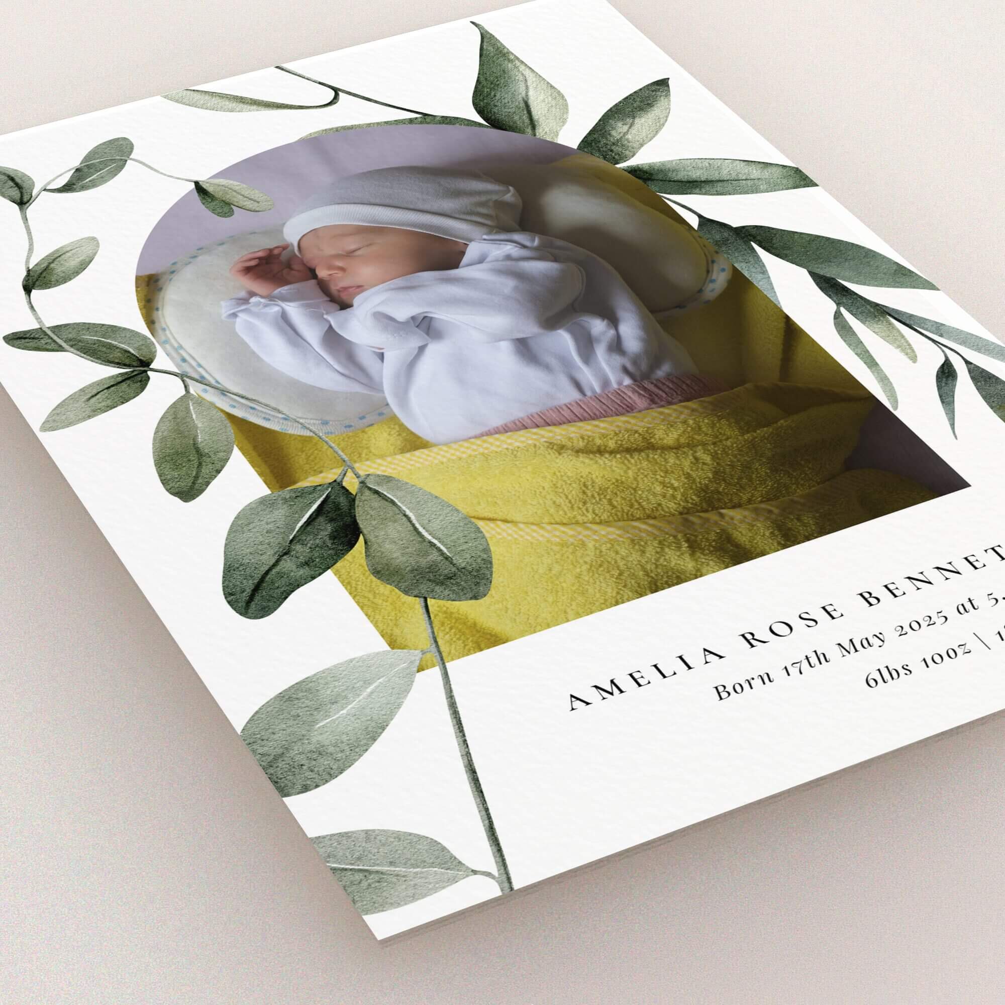 Elegant birth announcement card design featuring one photo with botanical accents and personalised text.