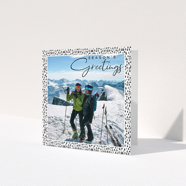 A family christmas card called 'Alpine Christmas'. It is a square (148mm x 148mm) card in a square orientation. It is a photographic family christmas card with room for 1 photo. 'Alpine Christmas' is available as a folded card, with tones of black and white.