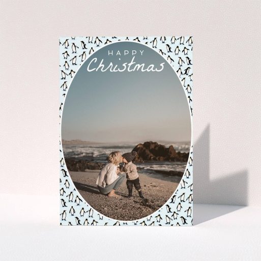 A family christmas card template titled "Arctic Christmas". It is an A6 card in a portrait orientation. It is a photographic family christmas card with room for 1 photo. "Arctic Christmas" is available as a folded card, with tones of blue and white.