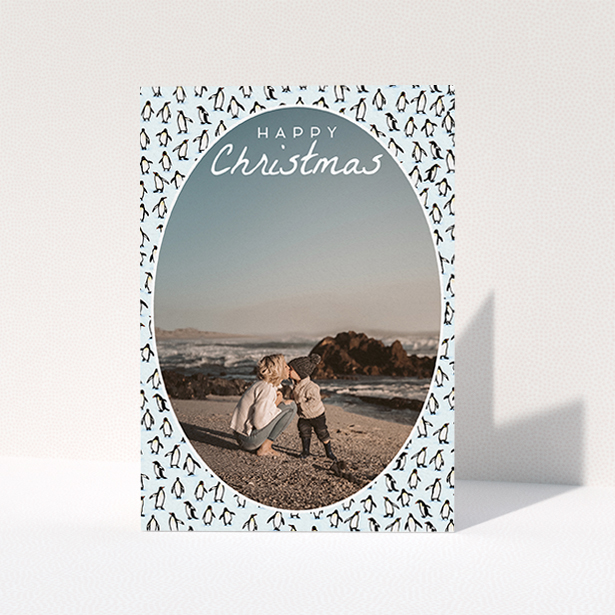 A family christmas card template titled "Arctic Christmas". It is an A6 card in a portrait orientation. It is a photographic family christmas card with room for 1 photo. "Arctic Christmas" is available as a folded card, with tones of blue and white.