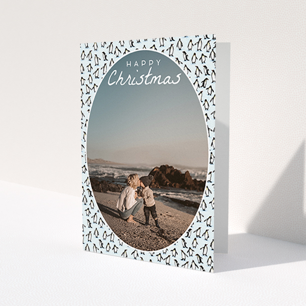 A family christmas card template titled "Arctic Christmas". It is an A6 card in a portrait orientation. It is a photographic family christmas card with room for 1 photo. "Arctic Christmas" is available as a folded card, with tones of blue and white.