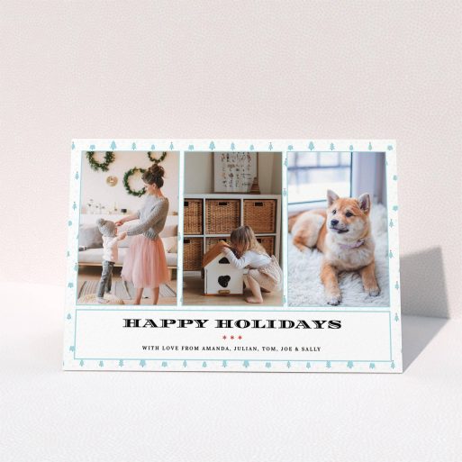A family christmas card design titled "Blue Forrest". It is an A5 card in a landscape orientation. It is a photographic family christmas card with room for 3 photos. "Blue Forrest" is available as a folded card, with tones of blue and white.