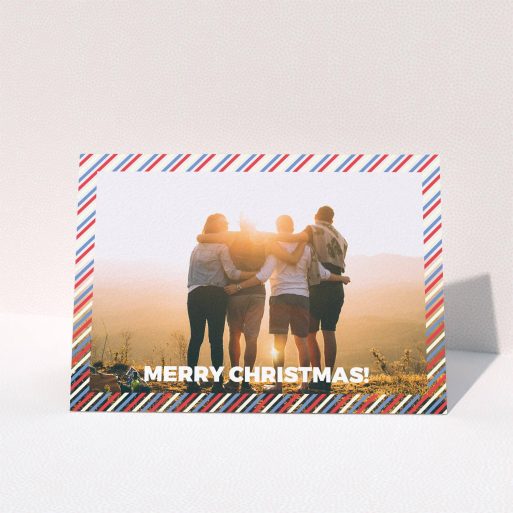 A family christmas card called "Bold Christmas Border". It is an A6 card in a landscape orientation. It is a photographic family christmas card with room for 1 photo. "Bold Christmas Border" is available as a folded card, with mainly white colouring.