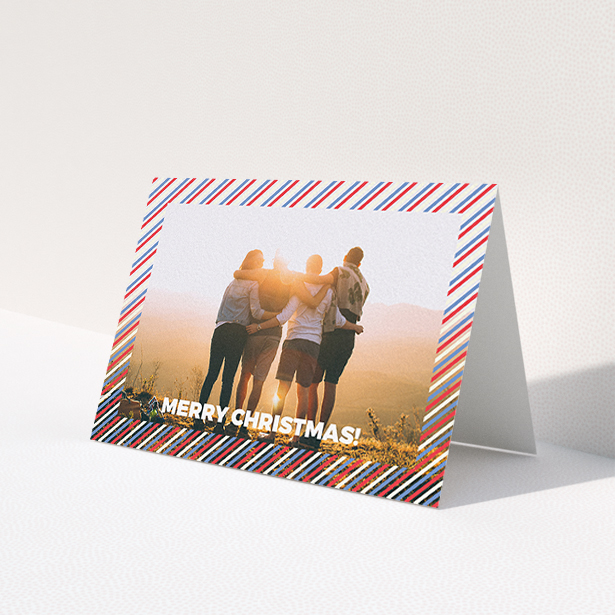 A family christmas card called "Bold Christmas Border". It is an A6 card in a landscape orientation. It is a photographic family christmas card with room for 1 photo. "Bold Christmas Border" is available as a folded card, with mainly white colouring.