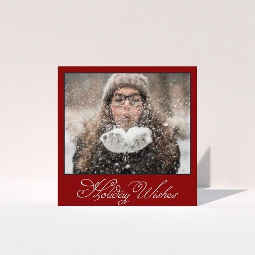 A family christmas card template titled "Fanned Deep Red". It is a square (148mm x 148mm) card in a square orientation. It is a photographic family christmas card with room for 1 photo. "Fanned Deep Red" is available as a folded card, with tones of burgundy and white.