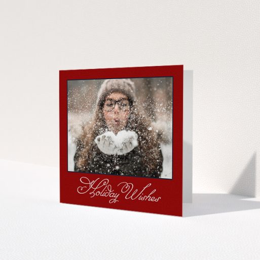 A family christmas card template titled 'Fanned Deep Red'. It is a square (148mm x 148mm) card in a square orientation. It is a photographic family christmas card with room for 1 photo. 'Fanned Deep Red' is available as a folded card, with tones of burgundy and white.