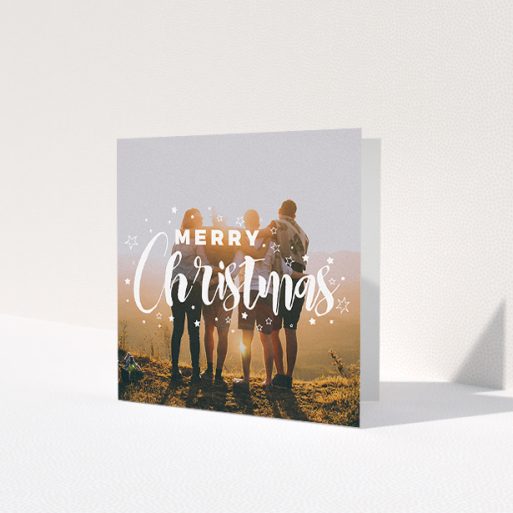 A family christmas card design named 'Jolly Old Christmas'. It is a square (148mm x 148mm) card in a square orientation. It is a photographic family christmas card with room for 1 photo. 'Jolly Old Christmas' is available as a folded card, with mainly white colouring.