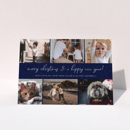 A family christmas card template titled "Navy Christmas Photos". It is an A5 card in a landscape orientation. It is a photographic family christmas card with room for 6 photos. "Navy Christmas Photos" is available as a folded card, with mainly blue colouring.