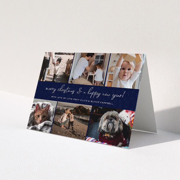 A family christmas card template titled 'Navy Christmas Photos'. It is an A5 card in a landscape orientation. It is a photographic family christmas card with room for 6 photos. 'Navy Christmas Photos' is available as a folded card, with mainly blue colouring.