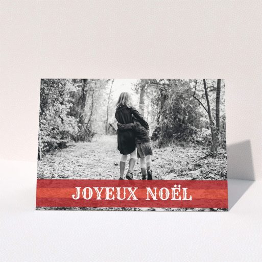 A family christmas card design called "Warm Christmas Banner". It is an A5 card in a landscape orientation. It is a photographic family christmas card with room for 1 photo. "Warm Christmas Banner" is available as a folded card, with mainly dark red colouring.