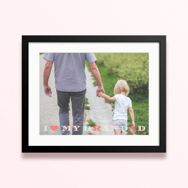 Framed and mounted photo print with one photo showing a grandparent and child holding hands