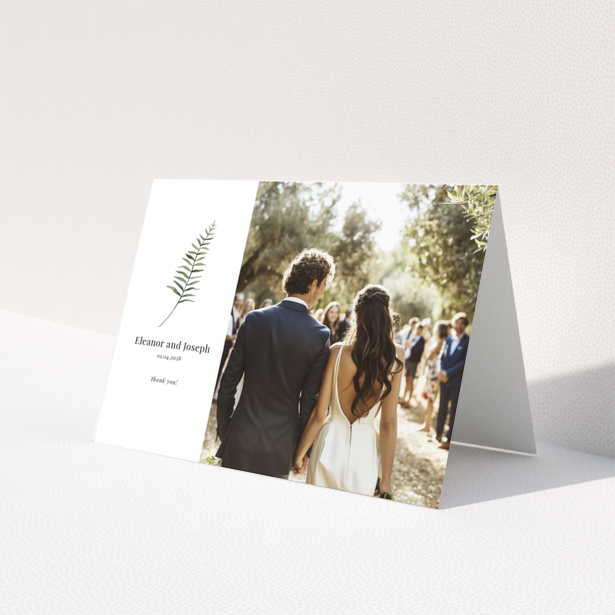 Elegant wedding invitation with a botanical design and one photo of a couple.