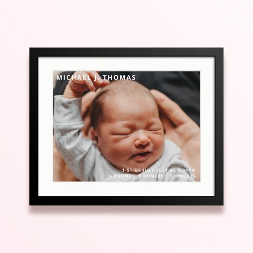 Framed and mounted photo print with one image of a newborn baby.