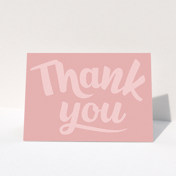 A first holy communion thank you card design titled "Big Pink Typography". It is an A6 card in a landscape orientation. "Big Pink Typography" is available as a folded card, with mainly pink colouring.