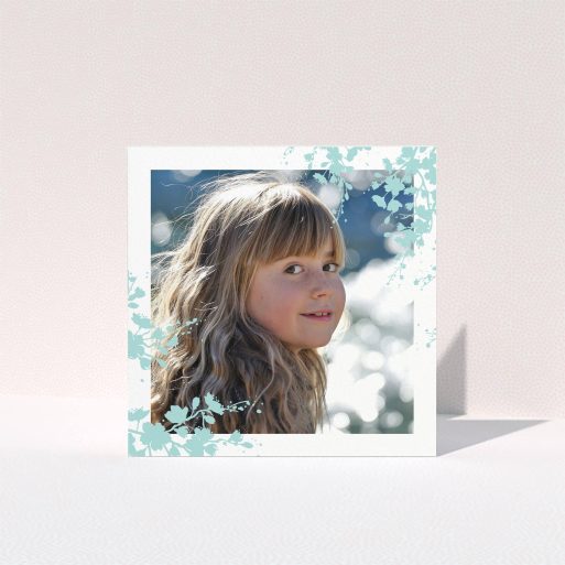 First Holy Communion Thank You Card Design - "Blue Forest Corners" A first holy communion thank you card called "Blue Forest Corners". It is a square (148mm x 148mm) card in a square orientation. It is a photographic first holy communion thank you card with room for 1 photo. "Blue Forest Corners" is available as a folded card, with tones of green and white.