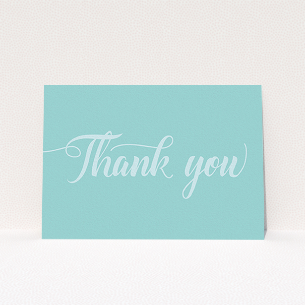 A first holy communion thank you card design named "Blue on Blue Typography". It is an A6 card in a landscape orientation. "Blue on Blue Typography" is available as a flat card, with mainly blue colouring.