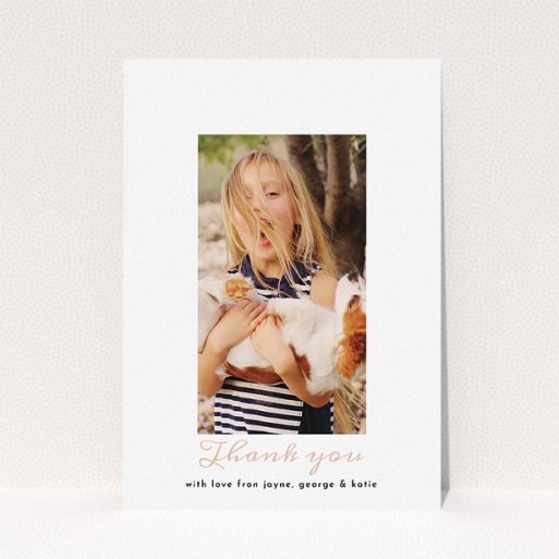A first holy communion thank you card called "Central Portrait". It is an A5 card in a portrait orientation. It is a photographic first holy communion thank you card with room for 1 photo. "Central Portrait" is available as a flat card, with tones of white and pink.