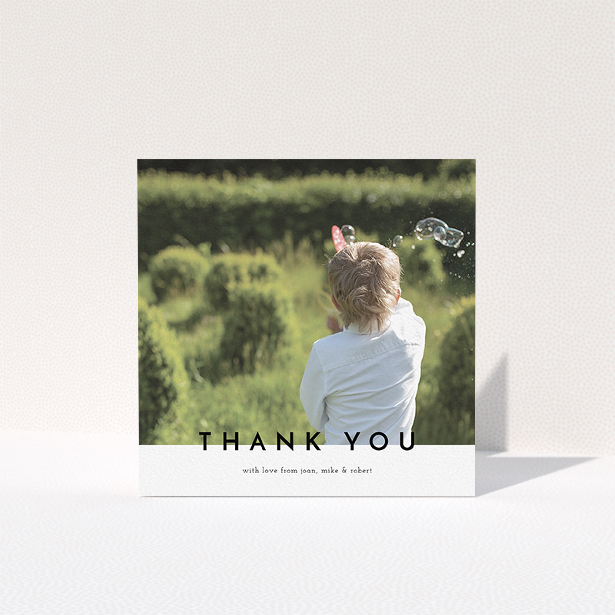 A first holy communion thank you card template titled "Cross Border". It is a square (148mm x 148mm) card in a square orientation. It is a photographic first holy communion thank you card with room for 1 photo. "Cross Border" is available as a folded card, with mainly white colouring.