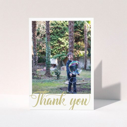 First Holy Communion Thank You Card Design - "Golden Thank You" A first holy communion thank you card design called "Golden Thank You". It is an A6 card in a portrait orientation. It is a photographic first holy communion thank you card with room for 1 photo. "Golden Thank You" is available as a folded card, with tones of cream and gold.