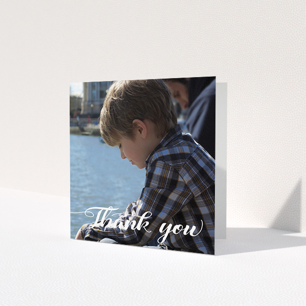 A first holy communion thank you card design named 'Handwritten Italic'. It is a square (148mm x 148mm) card in a square orientation. It is a photographic first holy communion thank you card with room for 1 photo. 'Handwritten Italic' is available as a folded card, with mainly white colouring.