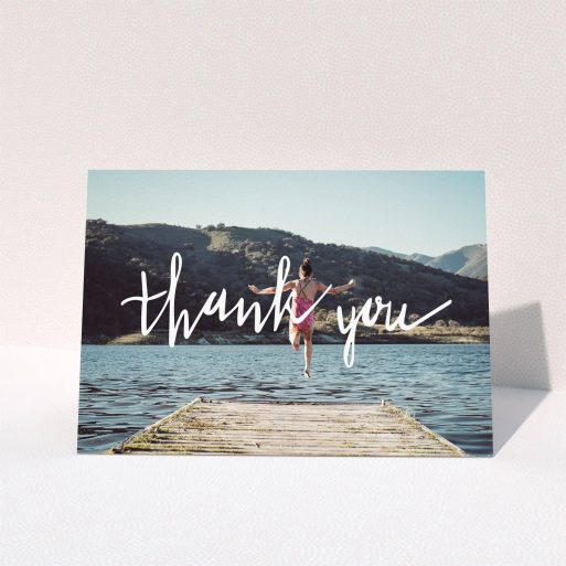 First Holy Communion Thank You Card Design - "Handwritten Thanks" A first holy communion thank you card named "Handwritten Thanks". It is an A5 card in a landscape orientation. It is a photographic first holy communion thank you card with room for 1 photo. "Handwritten Thanks" is available as a folded card, with mainly white colouring.