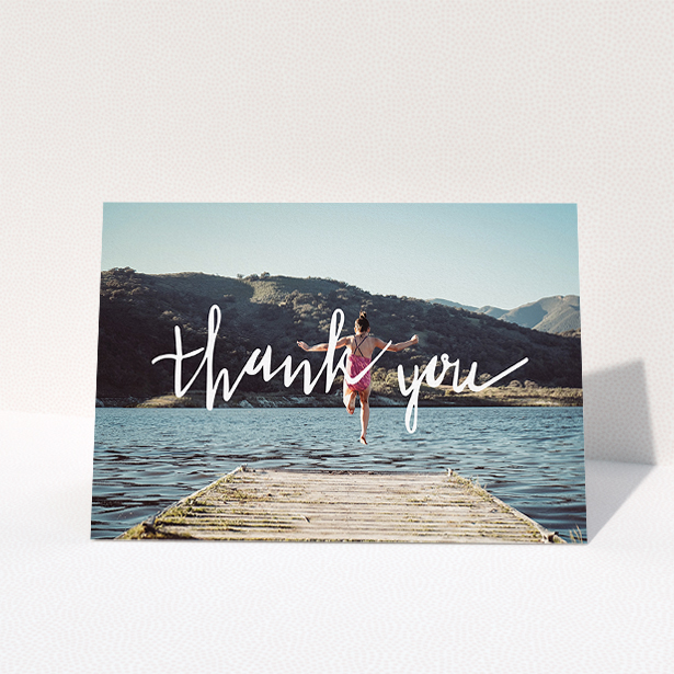 A first holy communion thank you card named "Handwritten Thanks". It is an A5 card in a landscape orientation. It is a photographic first holy communion thank you card with room for 1 photo. "Handwritten Thanks" is available as a folded card, with mainly white colouring.
