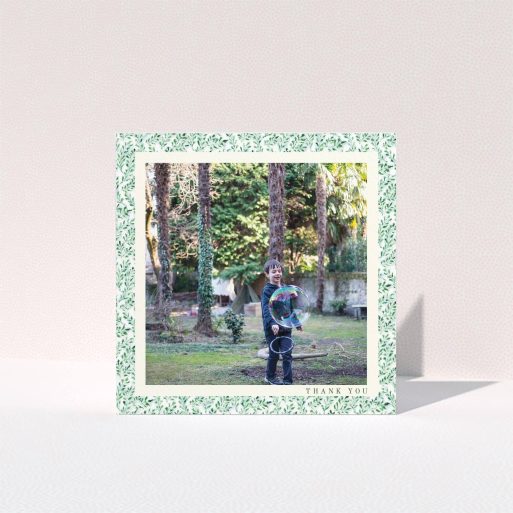First Holy Communion Thank You Card Design - "Hedgerow Frame" A first holy communion thank you card named "Hedgerow Frame". It is a square (148mm x 148mm) card in a square orientation. It is a photographic first holy communion thank you card with room for 1 photo. "Hedgerow Frame" is available as a folded card, with tones of green and white.