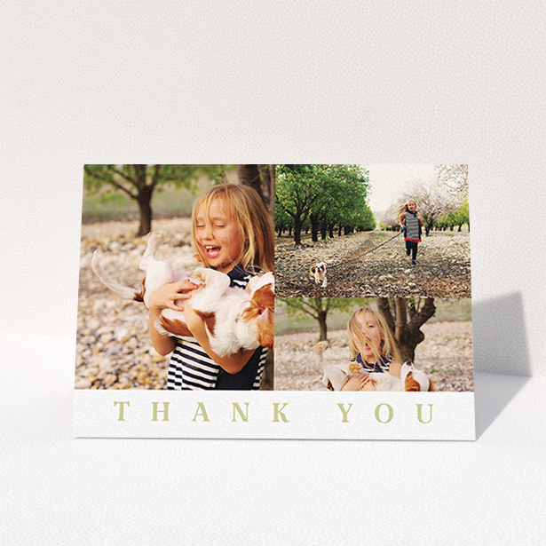 A first holy communion thank you card named "One and Two Half Frames". It is an A6 card in a landscape orientation. It is a photographic first holy communion thank you card with room for 3 photos. "One and Two Half Frames" is available as a folded card, with tones of white and gold.