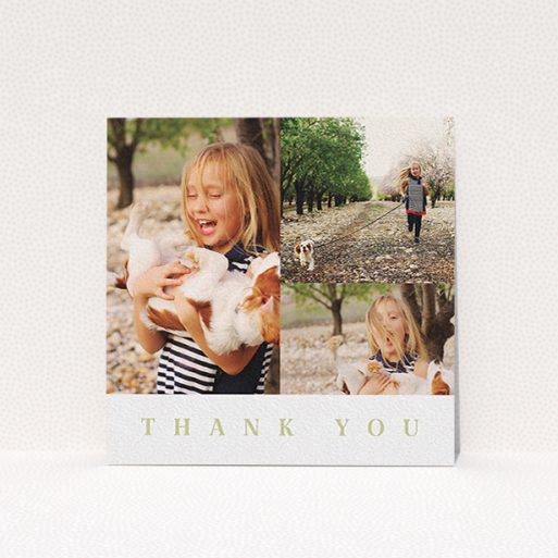 A first holy communion thank you card design named "One and Two Half Frames". It is a square (148mm x 148mm) card in a square orientation. It is a photographic first holy communion thank you card with room for 3 photos. "One and Two Half Frames" is available as a flat card, with tones of white and gold.