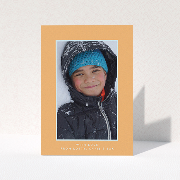 A first holy communion thank you card named "Orange and Mint". It is an A6 card in a portrait orientation. It is a photographic first holy communion thank you card with room for 1 photo. "Orange and Mint" is available as a folded card, with tones of orange and blue.
