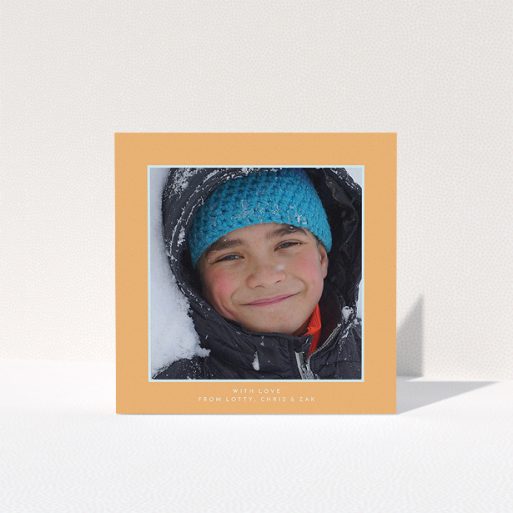 A first holy communion thank you card named "Orange and Mint". It is a square (148mm x 148mm) card in a square orientation. It is a photographic first holy communion thank you card with room for 1 photo. "Orange and Mint" is available as a folded card, with tones of orange and blue.