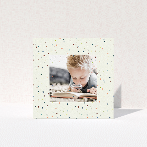 A first holy communion thank you card design titled "Pastel Dots". It is a square (148mm x 148mm) card in a square orientation. It is a photographic first holy communion thank you card with room for 1 photo. "Pastel Dots" is available as a folded card, with mainly cream colouring.
