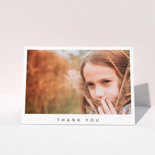 First Holy Communion Thank You Card Design - "Simple Thanks" A first holy communion thank you card design called "Simple Thanks". It is an A6 card in a landscape orientation. It is a photographic first holy communion thank you card with room for 1 photo. "Simple Thanks" is available as a folded card, with mainly white colouring.