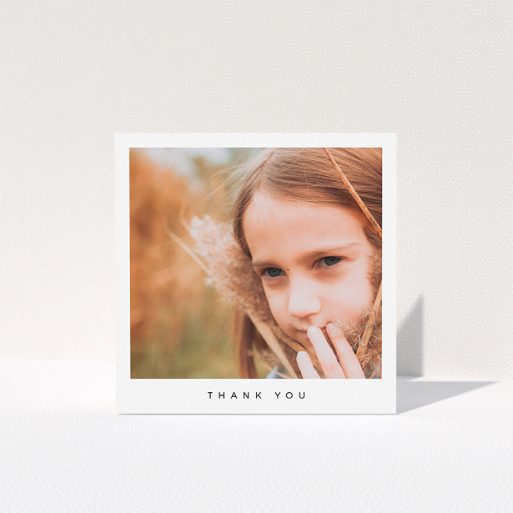 A first holy communion thank you card named "Simple Thanks". It is a square (148mm x 148mm) card in a square orientation. It is a photographic first holy communion thank you card with room for 1 photo. "Simple Thanks" is available as a folded card, with mainly white colouring.