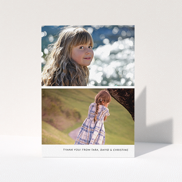 A first holy communion thank you card called "Stacked Landscapes". It is an A6 card in a portrait orientation. It is a photographic first holy communion thank you card with room for 2 photos. "Stacked Landscapes" is available as a folded card, with mainly white colouring.