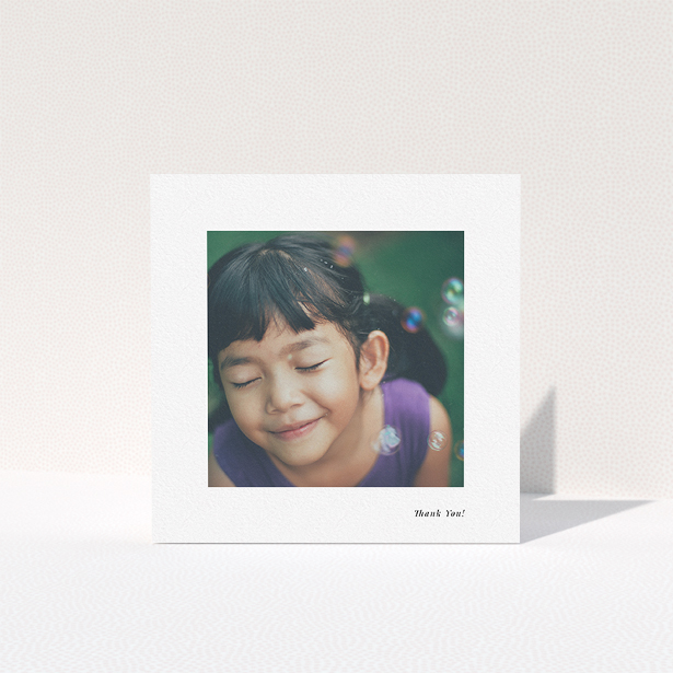 A first holy communion thank you card named "Thank You!". It is a square (148mm x 148mm) card in a square orientation. It is a photographic first holy communion thank you card with room for 1 photo. "Thank You!" is available as a folded card, with mainly white colouring.