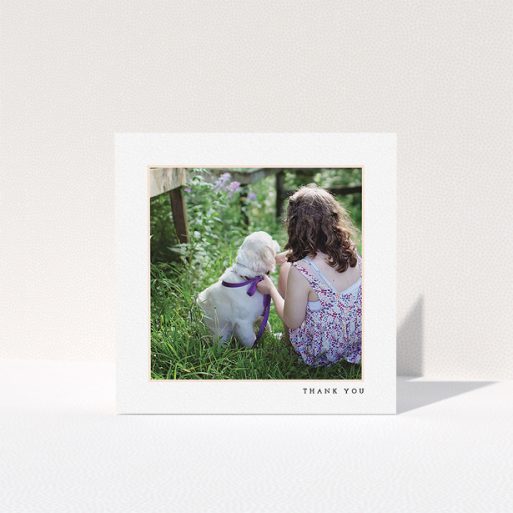 A first holy communion thank you card design called "Thin Pink Frame". It is a square (148mm x 148mm) card in a square orientation. It is a photographic first holy communion thank you card with room for 1 photo. "Thin Pink Frame" is available as a folded card, with tones of white and pink.