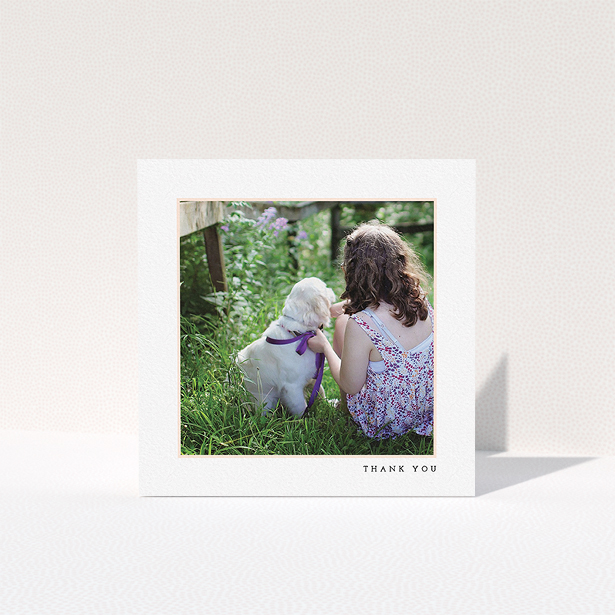 A first holy communion thank you card design called "Thin Pink Frame". It is a square (148mm x 148mm) card in a square orientation. It is a photographic first holy communion thank you card with room for 1 photo. "Thin Pink Frame" is available as a folded card, with tones of white and pink.