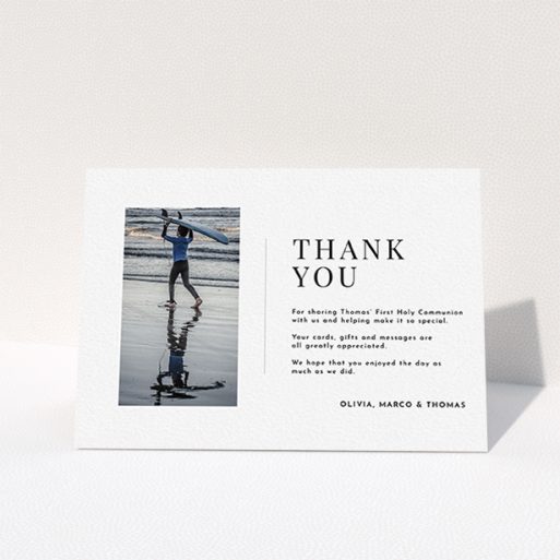 A first holy communion thank you card design named "Tiny Portrait". It is an A6 card in a landscape orientation. It is a photographic first holy communion thank you card with room for 1 photo. "Tiny Portrait" is available as a folded card, with mainly white colouring.