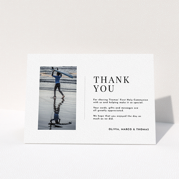 A first holy communion thank you card design named "Tiny Portrait". It is an A6 card in a landscape orientation. It is a photographic first holy communion thank you card with room for 1 photo. "Tiny Portrait" is available as a folded card, with mainly white colouring.