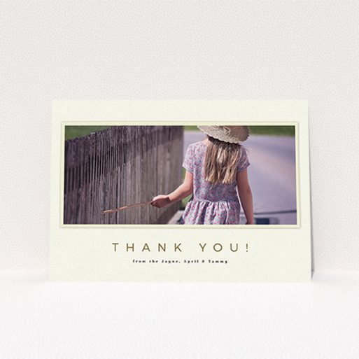 A first holy communion thank you card design titled "Torn Cream Frame". It is an A6 card in a landscape orientation. It is a photographic first holy communion thank you card with room for 1 photo. "Torn Cream Frame" is available as a flat card, with mainly cream colouring.