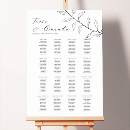 Unique seating plan design named "Flora Noir" featuring a black and white flora design with a hand-illustrated botanical feature on the top right-hand corner of the board, creating a natural and sophisticated feel, perfect for a rustic or outdoor wedding.. This one has 16 tables.