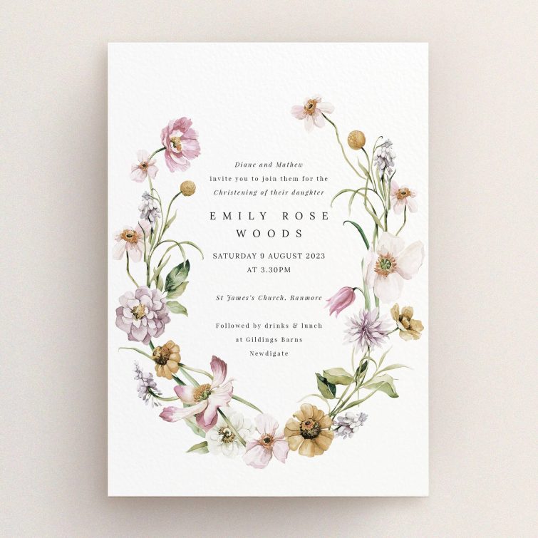 Floral christening invitation design with two images of floral arrangements.