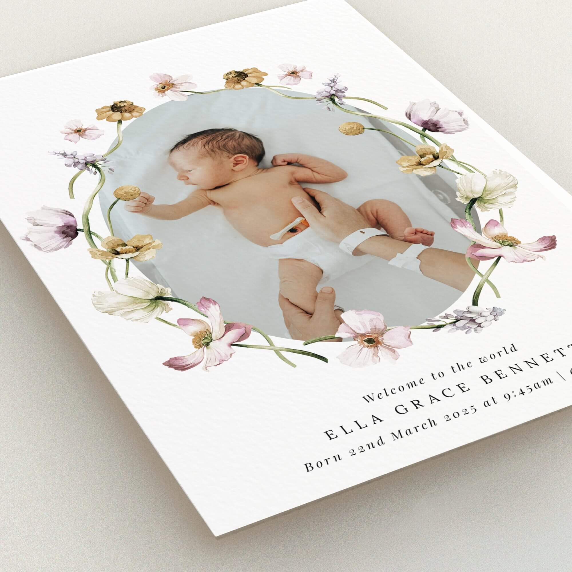 Floral-themed birth announcement card with one baby photo.