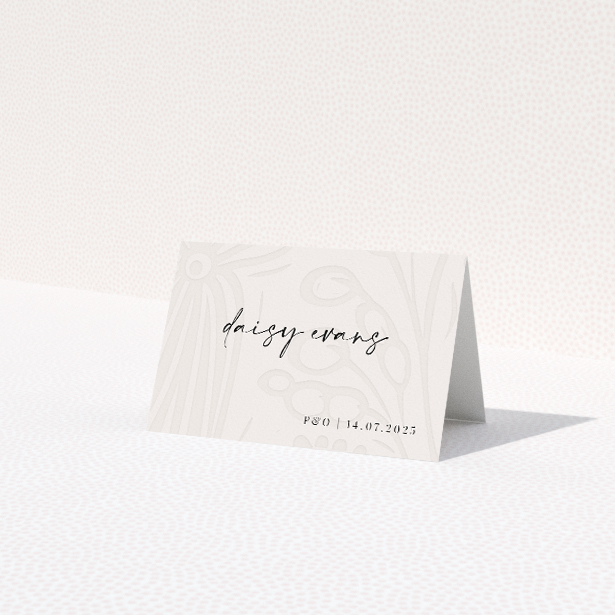 Place cards with delicate hand-drawn floral patterns on a soft ivory backdrop, featuring classic serif and script typography for refined charm, ideal for summer weddings from the Floral Behind suite This is a third view of the front